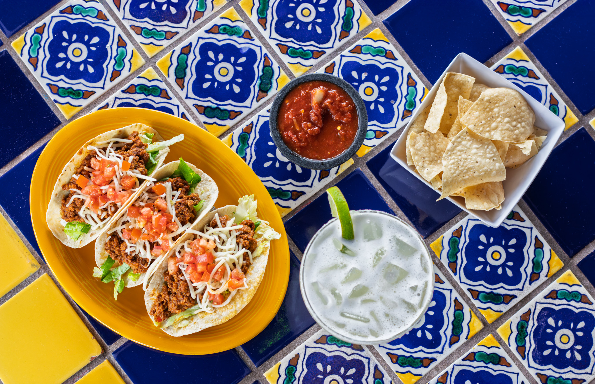 Taco plate with rice, beans, and chips